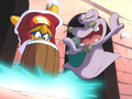 King Dedede attempts to whack Escargoon's shell, while the snail dodges his attacks.