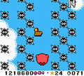 Kirby contending with a huge field of Gordos in Kirby Tilt 'n' Tumble