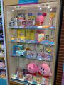 Display showcasing Kirby merchandise from the past