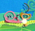 Kirby using his Yarn Whip to catch a Waddle Dee