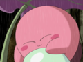 Kirby gets cozy with the egg and becomes drowsy.