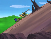 Tuff is left alone in the Armored Vehicle and is unable to stop it.
