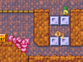 The Kirbys encountering a key to a nearby Treasure Chest in Green Grounds - Stage 4 in Kirby Mass Attack.