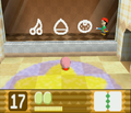 Adeleine gives Kirby a hint in pictographic fashion.