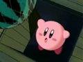 Kirby falls into a trap door after being lured to the laboratory.