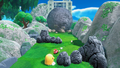 Kirby running from a giant boulder