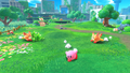 Kirby being chased by some Awoofies in Downtown Grassland