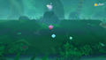 Kirby spotting a glowing area atop a rock in the dense forest