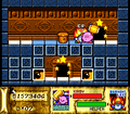 Kirby approaching a stake in Kirby Super Star