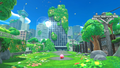 Kirby walking up to a city covered in grass