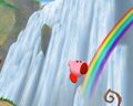 Kirby hopping around a rainbow