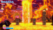 Kirby patiently waits for the spewing lava geyser to settle down.