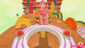 Screenshot of Kirby traversing the elevated walkway to the cannon