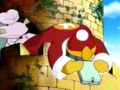 King Dedede over-earnestly observes the effect of his newspaper.