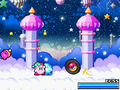 Kirby battling Grand Wheelie in Kirby Super Star Ultra