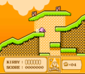 Kirby slides into an underground passage on the beach.