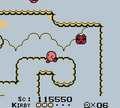 Kirby walking past a Kookler in Kirby's Dream Land
