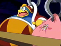 King Dedede and Kirby are held in place as they are jiggled by belts placed around their waists.