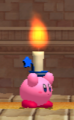 Kirby holding a candle in the Raisin Ruins level.