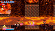 Kirby runs for the key before it and he are flattened by falling boulders.