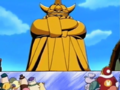 King Dedede reveals his maligned golden statue in the middle of town.