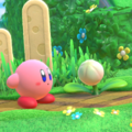 In-game tip image of Kirby standing next to a Pop Flower in Kirby Star Allies