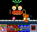 Fighter Kirby throwing a Smash Punch at Wham Bam Rock in Kirby Super Star
