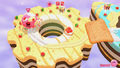Gameplay on the Magolor Cake stage, showing a gear cake with a hole in it