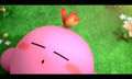 Screenshot of the "Restored to Life" cutscene, showing a butterfly posing on Kirby's head.