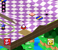 UFO Kirby slides on across the board. (Hole 3)