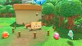 Kirby looking at the building site for his house, requiring at least 50 rescued Waddle Dees to complete
