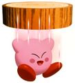 Artwork of Kirby falling through a log-shaped thin floor in Kirby 64: The Crystal Shards