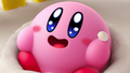 Kirby staring at the giant cake in ecstasy
