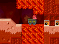 Kirby rides a Cart through a hot magma tube.