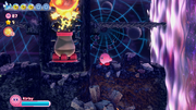 Kirby waits for an opportunity to pass the pillar being forced downward by the recoil of a Gigatzo's firing.