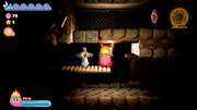 Kirby spots the Hammer Copy Essence in the dark labyrinth.