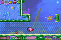 Kirby riding a water current in Kirby & The Amazing Mirror