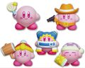 Four Kirby figurines from the "KIRBY MUTEKI! SUTEKI! CLOSET" merchandise line.