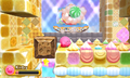 Kirby lures a Lollipop Tank's fire toward a stone block in the foreground to make progress.