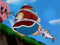A small fish bites the Dedede Doll as it floats in the river.