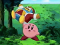 Kirby plays with his doll, causing King Dedede to spin around.