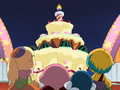 King Dedede delivers the giant cake to Kirby.