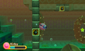 Kirby swimming against a Bomb Block barrier in Kirby: Triple Deluxe