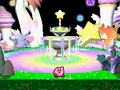 Kirby finishes his dance in front of one of the fountains after defeating a boss
