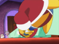 Dedede recoils from the pain of his toothache in front of Escargoon.