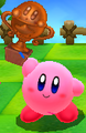 Kirby holding a bronze trophy
