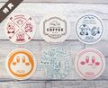 Full set of drink coasters given randomly for each drink purchased during chapter 2 and some drinks of chapter 3 of Kirby Café Tokyo, as well as the "Café au lait with Kirby marshmallow" drink during chapter 1 of Kirby Café Hakata