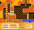 Kirby busts through a barricade to reach a side chamber in the caves.