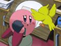Kirby being kept on task by Tokkori while working on a cartoon for King Dedede