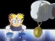 Knuckle Joe's father shows his medallion to his son.